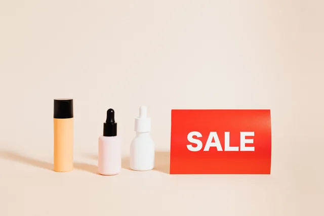 Three skincare bottles with a red sale sign, perfect for shopping promotions. Grouping products by commercial value